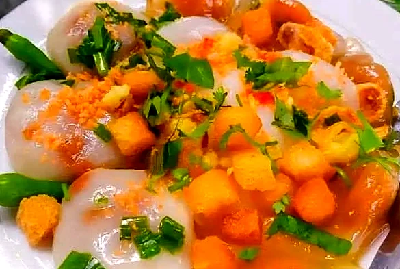 Clear tapioca dumplings with fried tofu cubes, scallions and chili