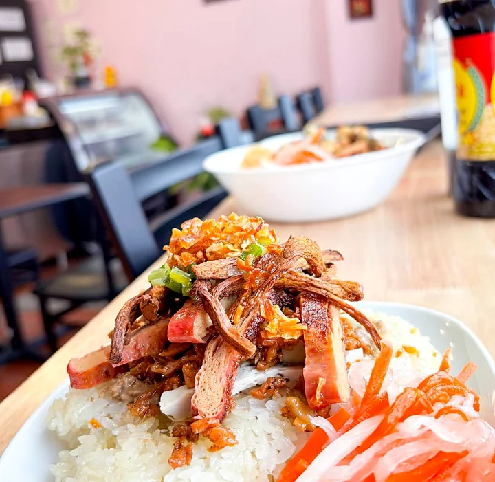 Rice topped with crispy shredded vegetarian topping, scallions and pickled carrot and daikon
