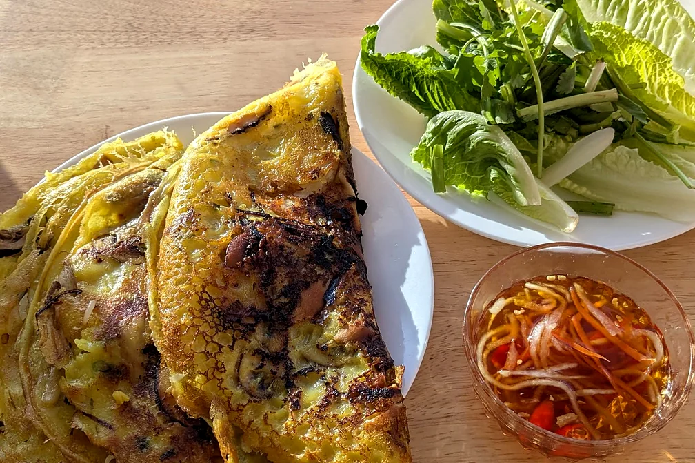 Vegan Sizzling Crêpe: Vietnamese crispy crepe with lettuce, herbs and a dipping sauce